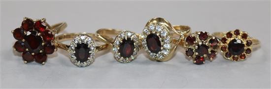 Six assorted 9ct gold and gem set rings including garnet